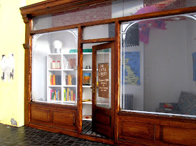 Modern dolls' house miniature pop-up Little Library.