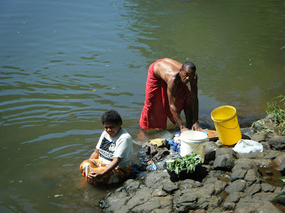 washing clothes in the river