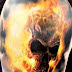 Flaming skull tattoo on arm