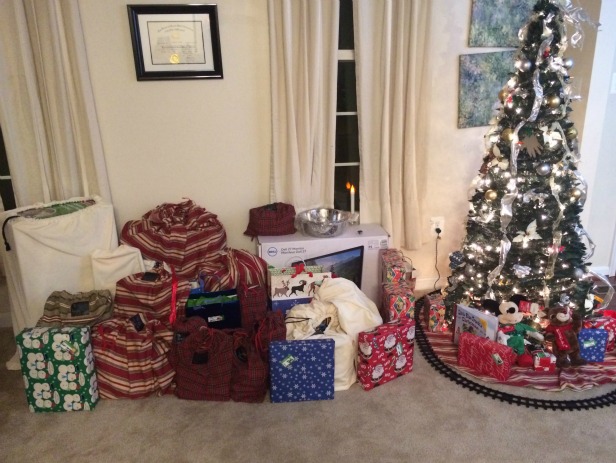 Check out all of my fabric gift bags! They're easy to "wrap" gifts in and they are eco friendly. Reusable fabric gift bags around the Christmas tree.