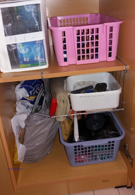 Pink box filled with tools, dtain openers etc.