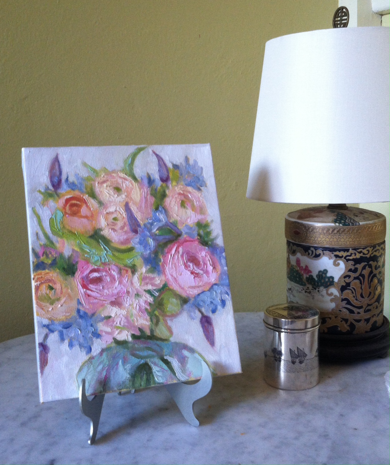 A Bridal Bouquet Portrait displayed on the easel included with the painting.