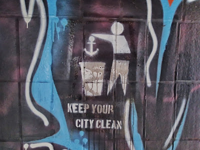 Keep your city clean art work on Berlin Wall