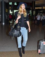 Very easy, but it's casual fashion trend as the Supermodel, Bridget Malcolm, 23, appeared wearing a navy jeans, worn with a huge hat, and stuffed a dark blazer at the airport in Sydney, Australia on Sunday, December 20, 2015.