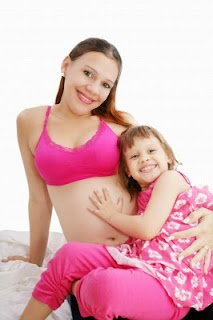 Pregnant woman and daughter freedigitalphotos.net