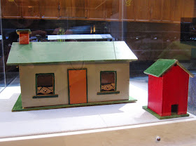 Back view of a vintage toy farm outhouse and house from Sydney shop Walther & Stevenson.