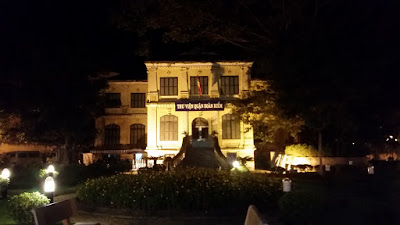 Front facade of a police station in Hanoi, Vietnam at night