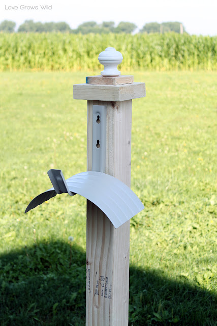LoveGrowsWild.com | Make this DIY Garden Hose Holder to add great curb appeal to your home! #diy #garden # home
