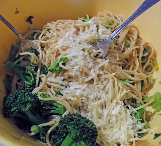 Two Forks Tossing Spaghetti, Broccoli, and Parmesan