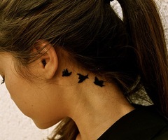 Small Bird Tattoo Behind Ear