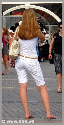 Girl in white breeches on the street