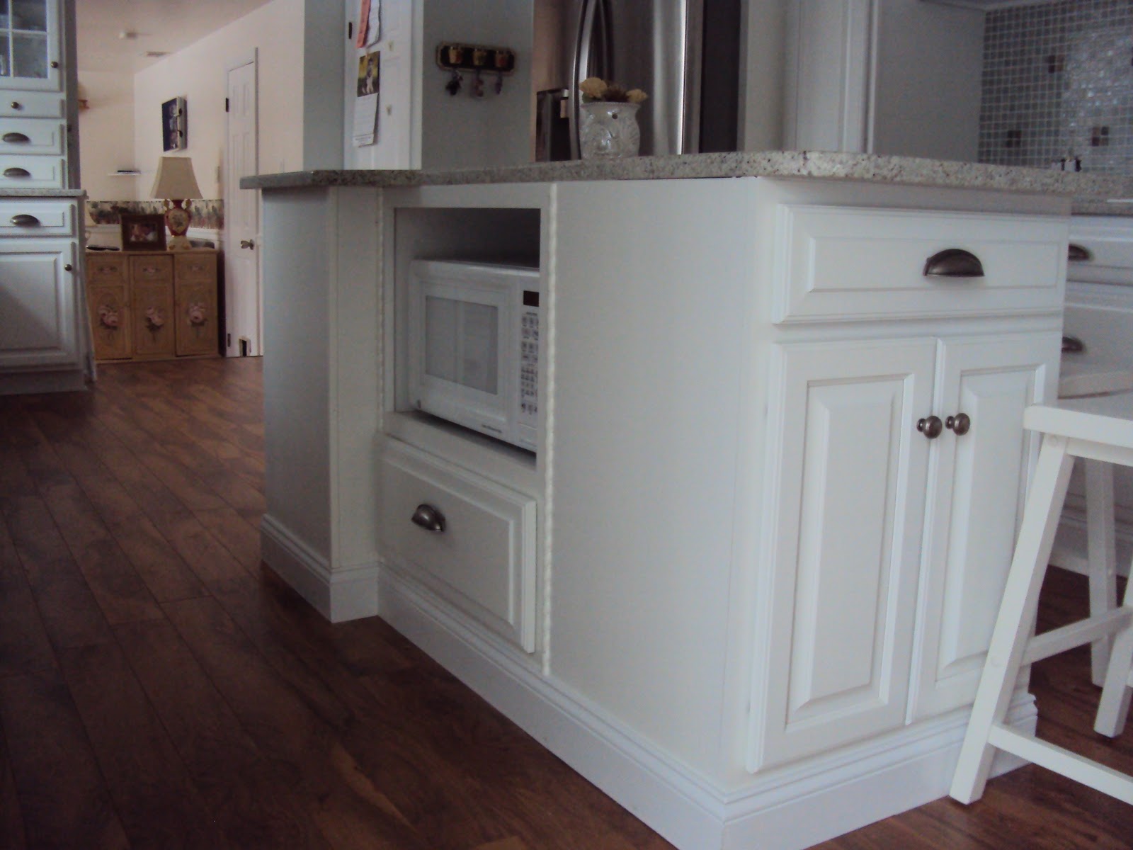 Cottage Beach House The kitchen Island, a Hutch design and French Doors