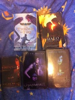 Library books throne of fire by Rick Riordan, Halo by Alexandra Adornetto, Firespell, Charmfall & Hexbound by Chloe Neill