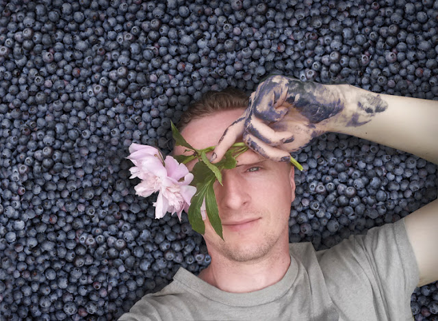 Paul Cram on a bed of Blueberries