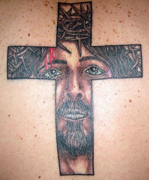 The last of my religious tattoos has Jesus peeking out of yer back through 