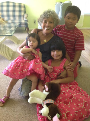 Toastmaster of the Year Elaine Gavero with her 3 grandchildren
