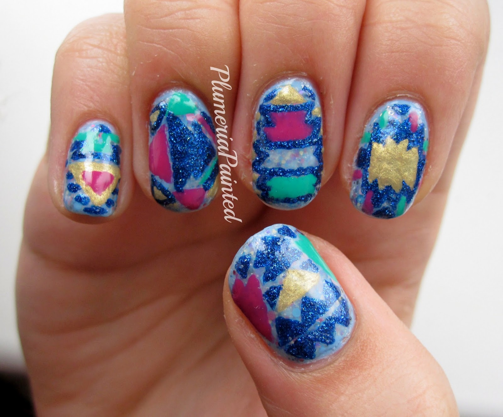 PlumeriaPainted Blue Tribal Nails (inspired by my top!)