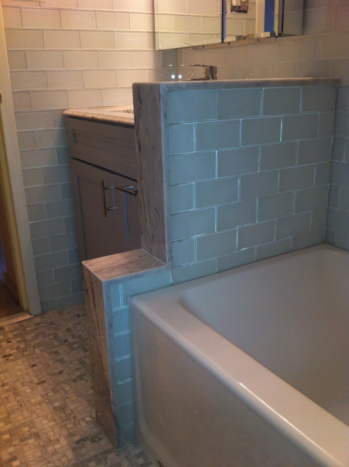 The Floor Lord Complete Bathroom Remodel. Floor to Ceiling Glass Subway Tile, Mosaic Floor