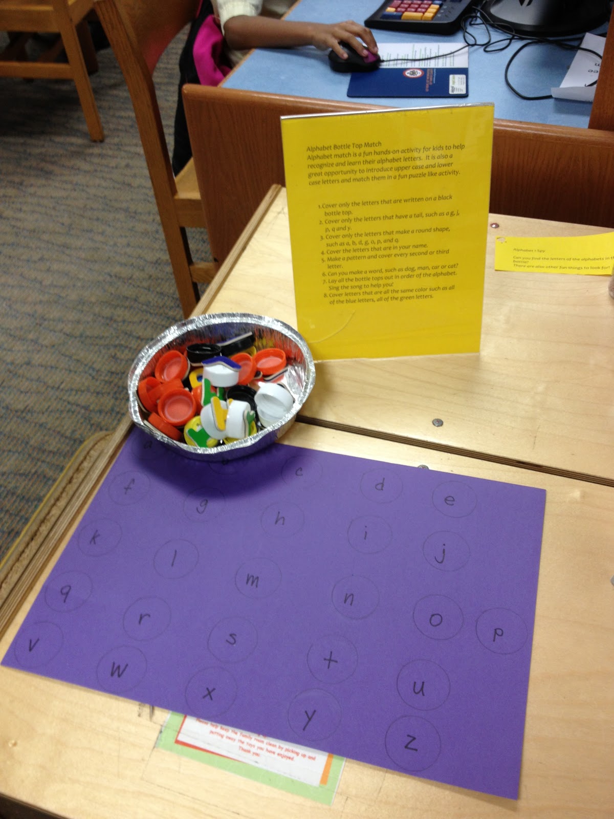 Bottle cap match game teaches the ABCs MetroKids