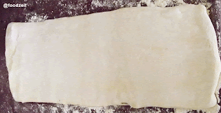 Rolled out puff pastry dough with the butter plate incorporated within the dough