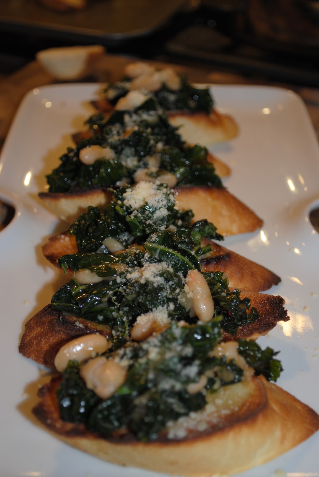 Winter Appetizer Braised Kale and White Bean Bruschetta The Enchanted Spoon