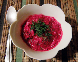 Bowl of Dark Pink Soup with Green Dill