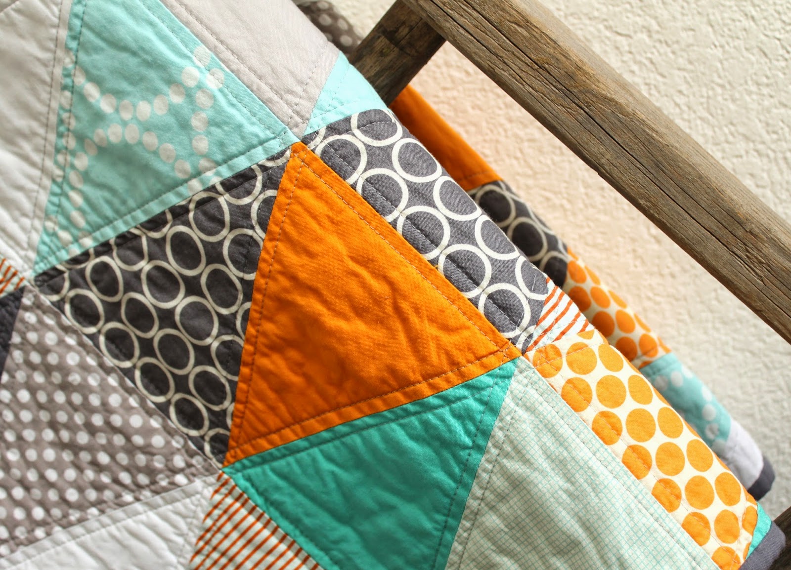 craftyblossom orange and aqua isosceles triangle quilt.