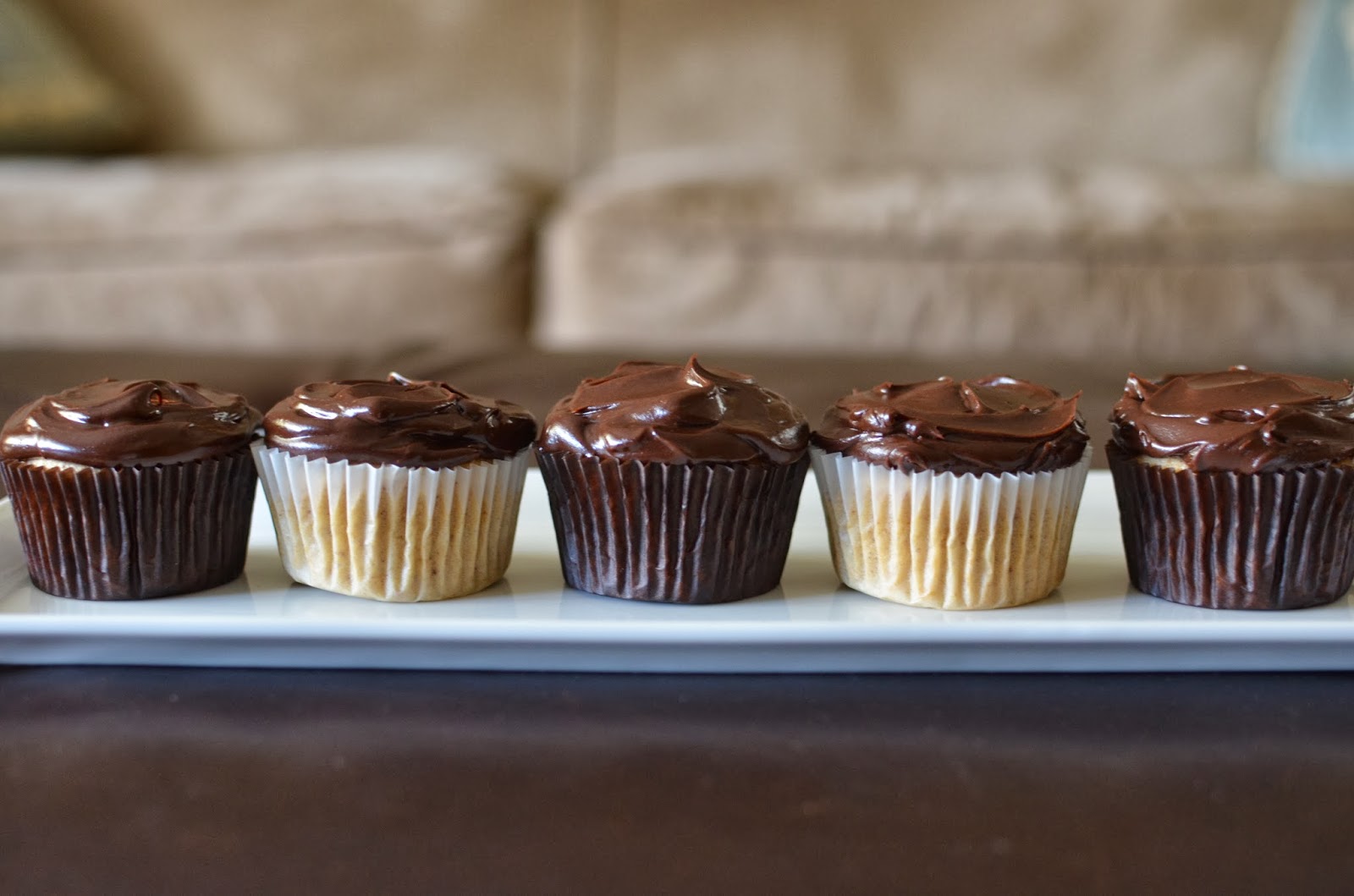 Playing with Flour Almondhazelnut cupcakes with ganache frosting