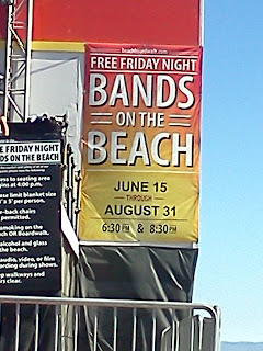 Picture of a banner announcing the free friday night bands on the beach concert series at Santa Cruz Beach Boardwalk.