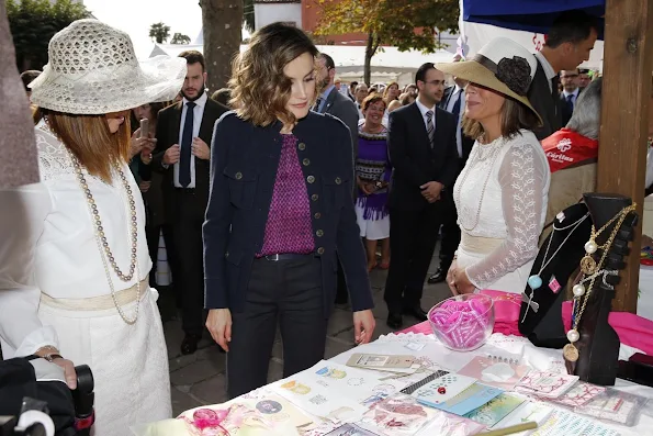 King Felipe and Queen Letizia visit Colombres, Asturias, Spain Queen Letizia wore Hugo Boss Trouser - pant, wore carolina herrera blouse, tous earrings