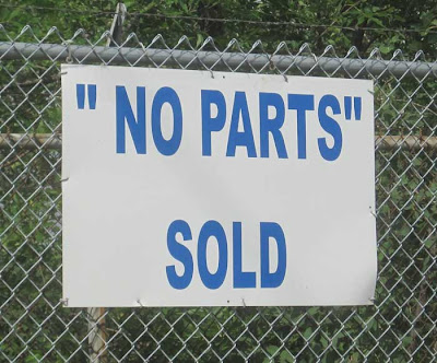 Sign in all caps reads NO PARTS SOLD with NO PARTS in quotes