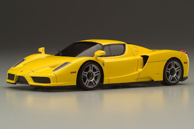 Photo of a yellow Ferrari F150 Enzo.