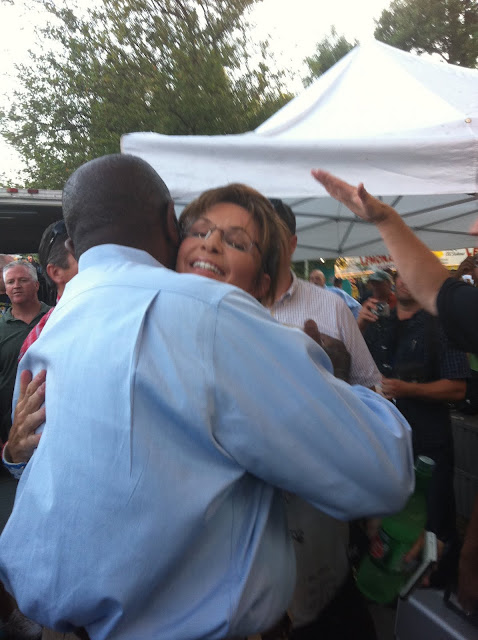 Cain hugging Palin