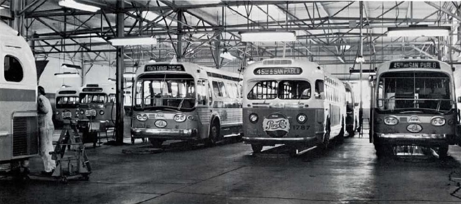 Circa 1970. Bus garage showing older and newer buses ~