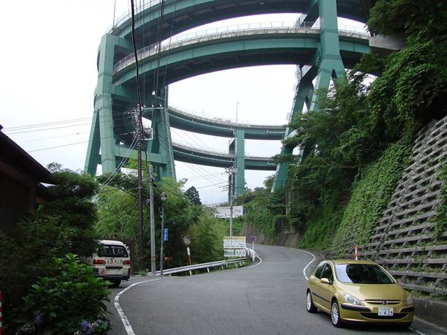 built the Kawazu-Nanadaru Loop Bridge, also known as the Japanese Double loop spiral, in Kawazu, Japan. This double spiral brings cars up and down a full 45 meters while being seemingly suspended in a valley between two mountainsides. The spirals measure 80m in diameter and the whole ramp section is 1.1km long.