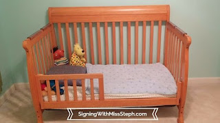 toddler bed with pillow, blanket, and stuffed animals ready to go