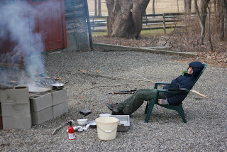 And rest by the fire. Hot cocoa provided. boy in front of fire