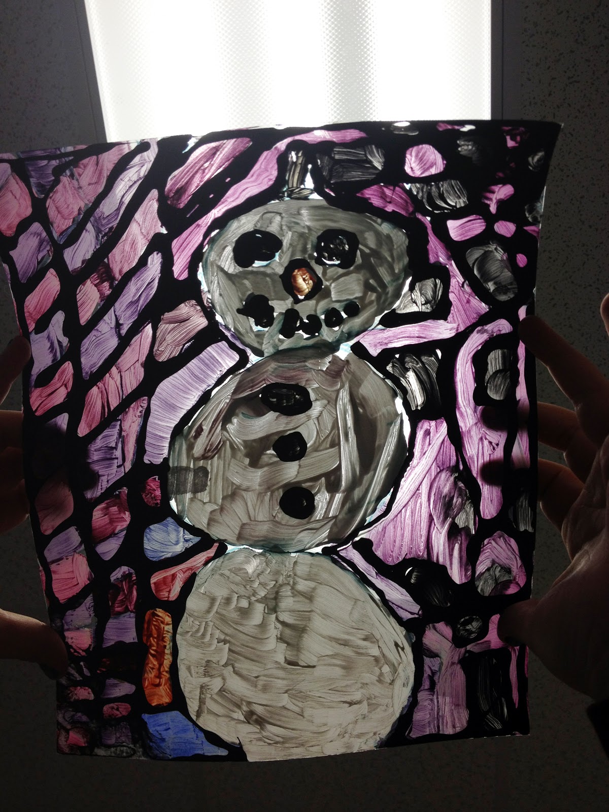 creat[ed] Faux Stained Glass Winter elementary art lesson