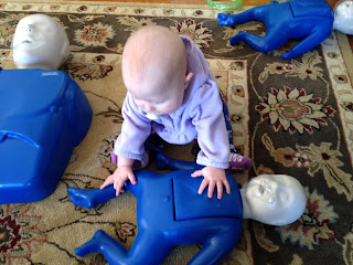 Addie helps a fellow baby.