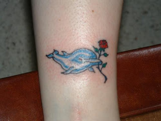 Cute Dolphin Tattoo with Flower Design