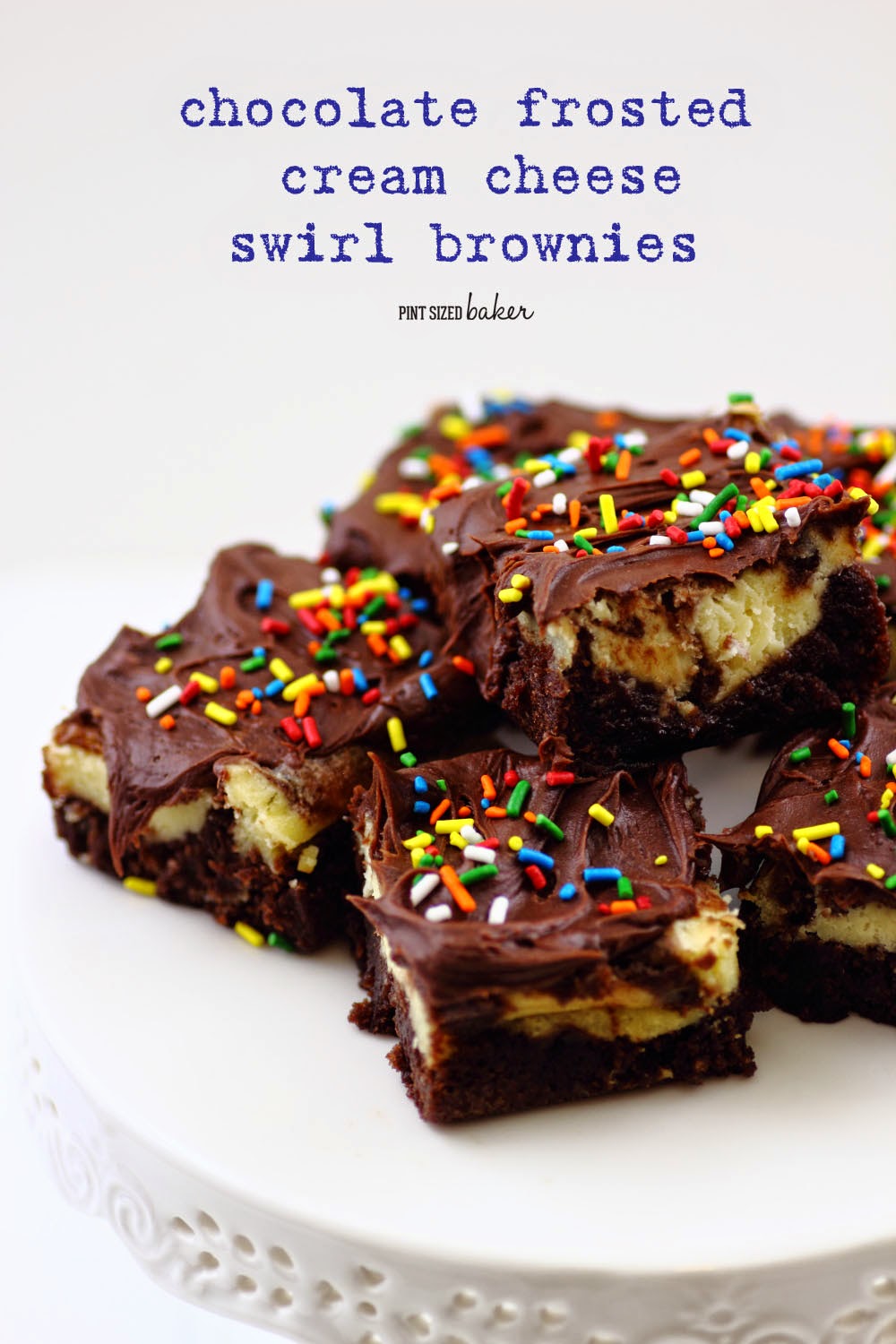 Chocolate Frosted Cheesecake Swirled Brownies. Covered in Rainbow Sprinkles- kids of all ages will love them!