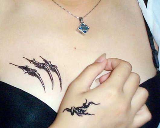 Woman Chest Tattoos 3