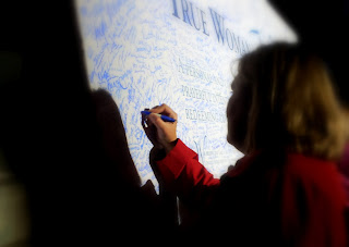 Signing the True Woman Manifesto signing true woman '12 conference manifesto