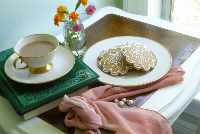 scarf, coffee, flowers, and napoleonic bee honey-vanilla cookies