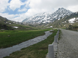 Gotthardreuss flows alongside the cobblestones of the Strasse Vecchia, descending from the Gotthardpass, Switzerland.