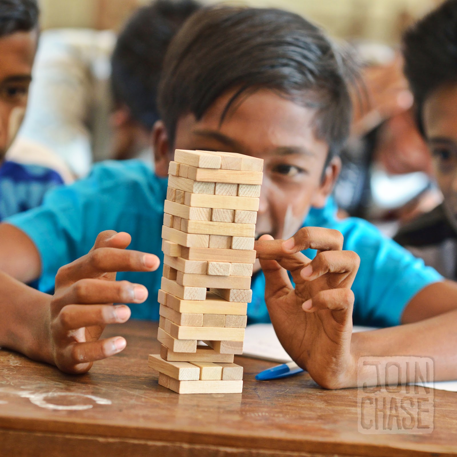 Playing Stack 'Em A student in Myanmar playing Stack 'Em during an English lesson.