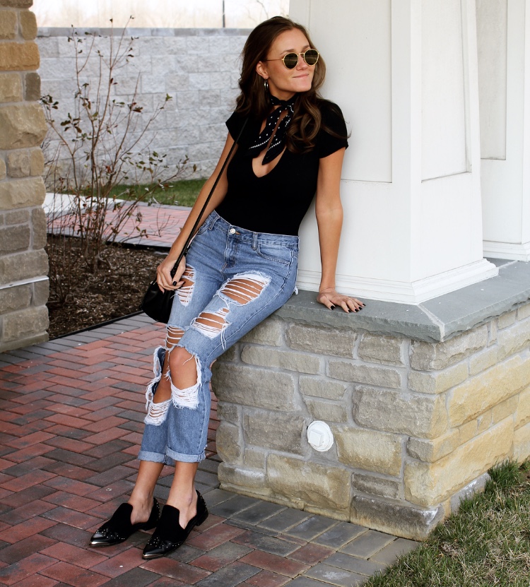 black bodysuit with ripped jeans