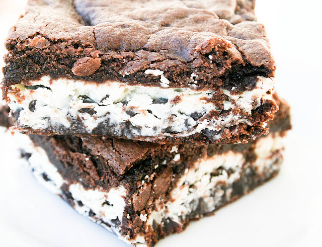 These cookies and cream brownies are so easy to make and it all starts with a chocolate cake mix and some Hershey's candy bars.