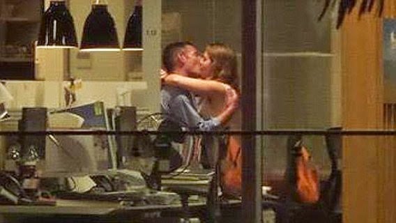 A married man and newly engaged woman have sex in the office..and its caught on tape photo image