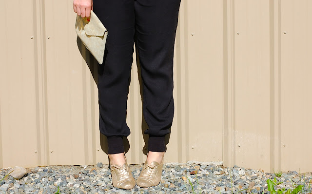 Smythe tuxedo blazer, Vince silk jogger pants, French Connection silk tank, gold Gap clutch and gold brogues.